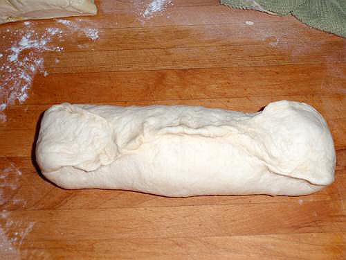 shaping loaf of bread
